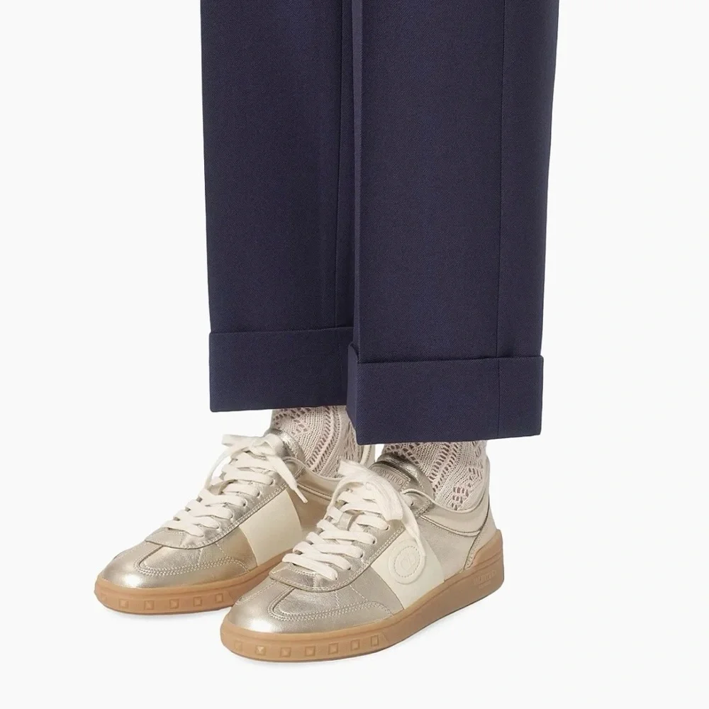 Valentino Garavani Women’s Upvillage Trainer Sneakers in Laminated Calfskin Gold